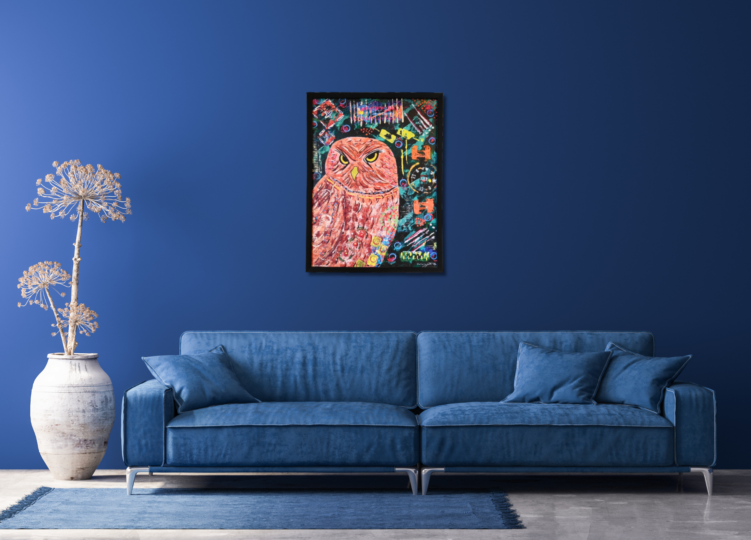 Blue sofa in a living room with a colorful abstract painting on the wall.