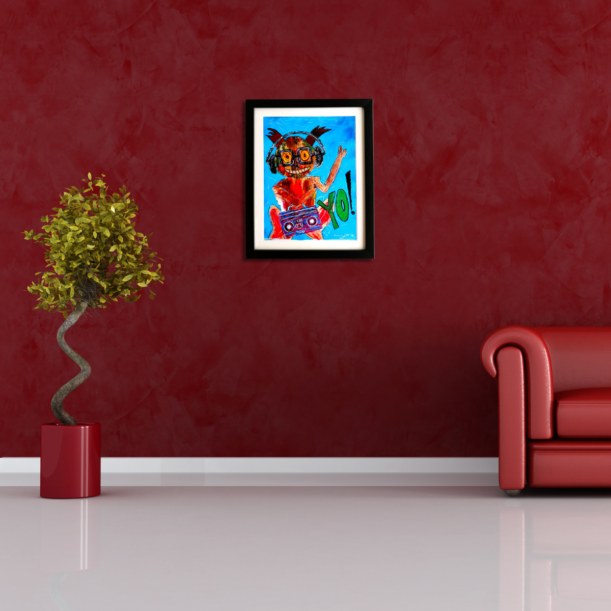 Framed artwork on a red wall with a plant and red sofa in the foreground